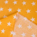 Bavlněné plátno SIMONA - vzor 630 bílé hvězdičky na žlutě oranžovém - metráž š. 160cm